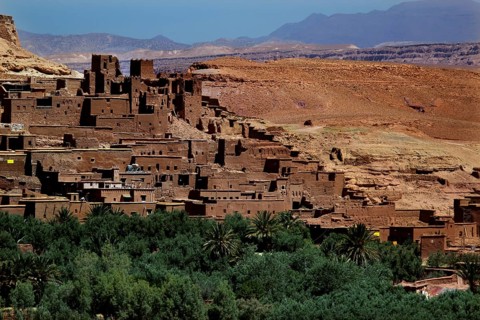 Clay buildings in Ait Benhaddou surrounded by lush vegetation, Ait Benhaddou, Ouarzazate, Morocco