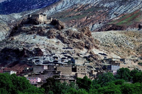 Village in rocky surroundings of the High Atlas with traditional houses and impressive landscape,