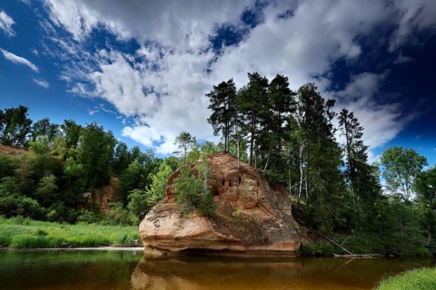 Impressive Zvartes rocks in the middle of Gauja National Park under blue skies, Gauja National