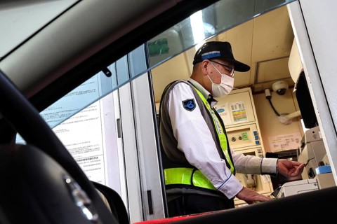 Cashier at a toll station in Kobe, Kobe, Japan