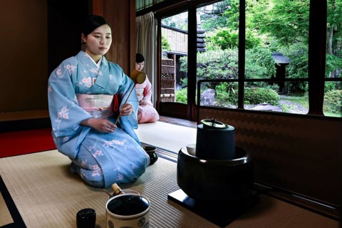 Tea master in traditional kimono during a tea ceremony, Kyoto, Higashiyama, Japan