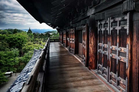 Sanmon wooden main gate of Nanzen-ji Temple in Kyoto with lush nature in the background, Kyoto,