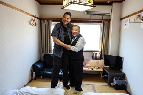 Smiling host and guest pose in traditional lodging in Kanazawa, Kanazawa, Japan