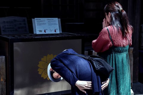 People pray at Chureito Shrine, an atmosphere of spirituality, Fujiyoshida, Japan