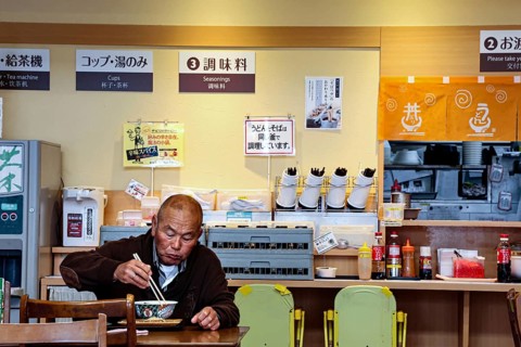 Guest eats ramen at a simple restaurant in Aso, Aso, Japan