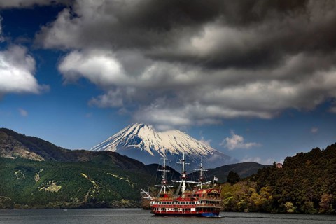 A pirate ship sails on the Ashinoko with the majestic Fujiyama in the background, Hakone, Japan