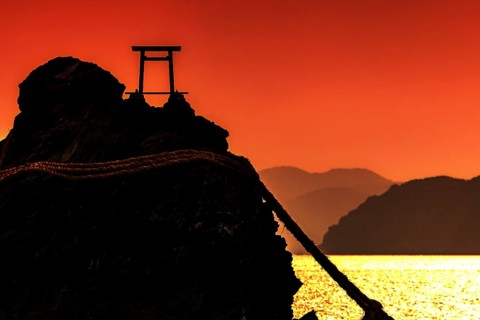 Meoto Iwa silhouette at sunrise with Torii, Ise, Mie, Japan