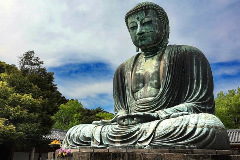 The majestic Big Buddha at Kotokuin Temple surrounded by nature in Kamakura, Kamakura, Kanagawa,