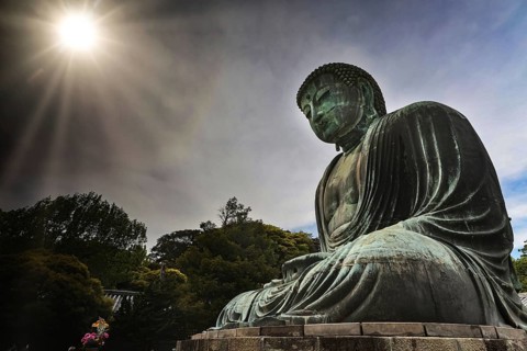 The bronze Big Buddha in Kotokuin Temple with dramatic sunlight in Kamakura, Kamakura, Kanagawa,