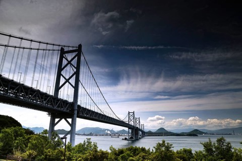 Impressive Seto Ohashi Bridge stretches across the sea under a cloudy sky, Seto, Japan