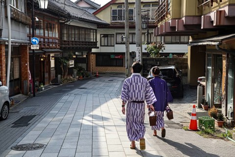Yukata bathers stroll the quiet streets of Yamanouchi, Yamanouchi, Japan