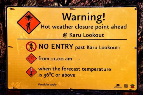 Warning sign in the Valley of the Winds with information about access times, Kata Tjuta, Northern
