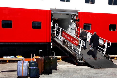 Gangway on Hurtigruten ship with luggage and passenger, Kirkenes, Finnmark, Norway