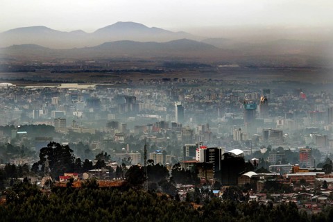 Expansive city view with mountains in the background, surrounded by haze, Addis Ababa, Ethiopia