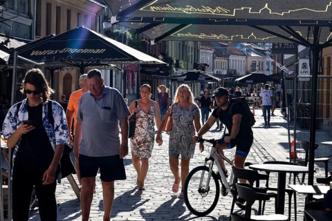 Vilnius Gatve in Kaunas with passers-by and cyclists in the summer sun, Kaunas, null, Lithuania