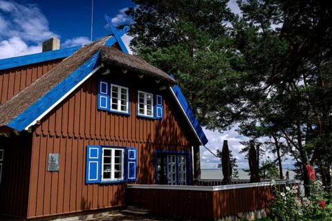 Traditional wooden house by Thomas Mann in Nida with blue shutters, Nida, Lithuania