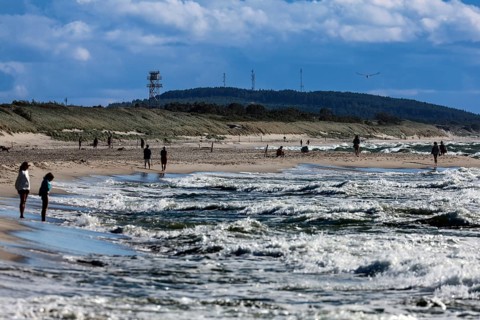Beach visitors enjoy sunny weather at sea, Nida, Lithuania