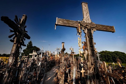 Large wooden cross on a hill with numerous smaller crosses, Siauliai, Lithuania
