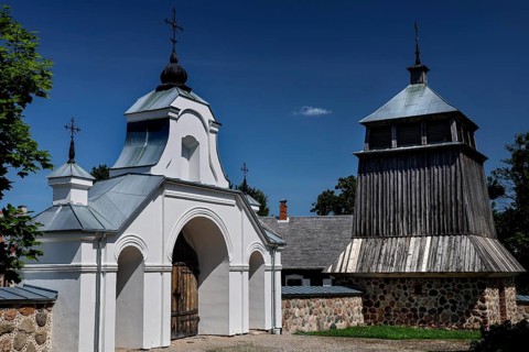 Church with wooden bell tower and gate in the open-air museum, Rumsiskes, Kauno apskritis,
