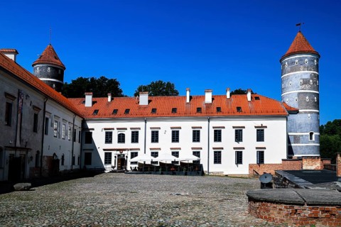 Historic Panemune Castle with distinctive towers and tiled roof
