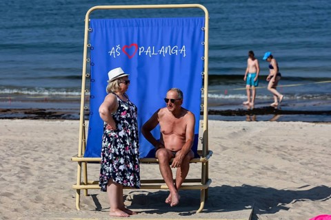 Two bathers on a sun chair on Palanga beach, children in water, Palanga, null, Lithuania