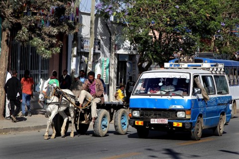 Street scene with cars and a horse-drawn cart, Mekele, Ethiopia