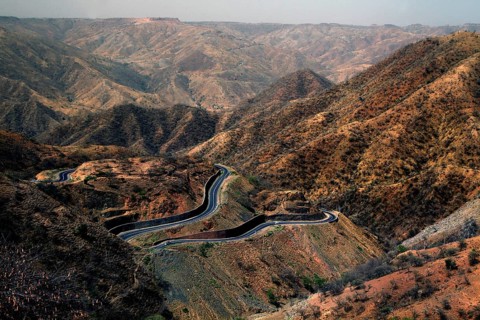 Serpentine road snakes through the barren Semien Mountains