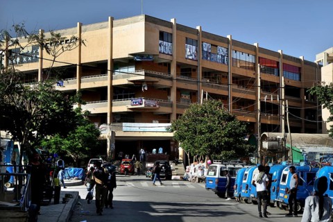 Busy road scenario in front of a large building, Mekele, Ethiopia