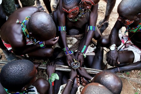 Group of Hamers gathers closely during a traditional initiation ritual, Turmi, null, Ethiopia