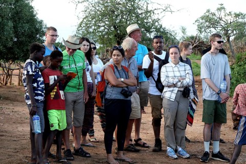 Group of tourists observes the Hamer initiation ritual with interest and curiosity, Turmi, null,