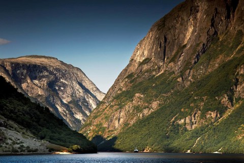 Majestic panorama of Nærøyfjord near Gudvangen with high mountains and still water, Gudvangen,