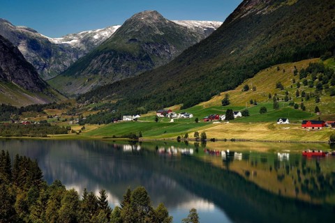 View of Fjærlandsfjord with surrounding mountains and green hills, Fjærlandsfjord, null, Norway