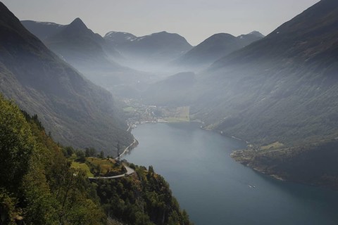 View of Geiranger and Geiranger Fjord from the Ørnevegen Serpentine Road, Geiranger, Møre og