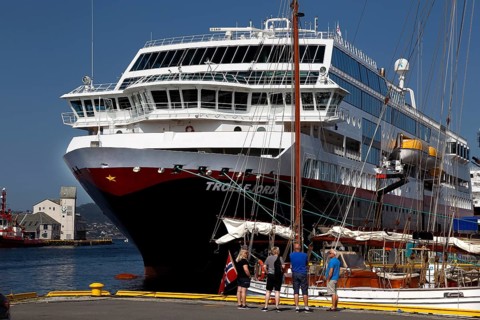 Hurtigruten ship in Bergen harbour, passenger ready people on deck, Bergen, Norway, zero