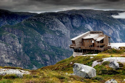 Panoramarestaurant Øygardstølen towers dramatically over the Lysefjord under a grey sky, Lysefjord,