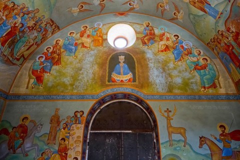 Church interior with detailed wall paintings of saints and biblical scenes, domed church by Kvemo