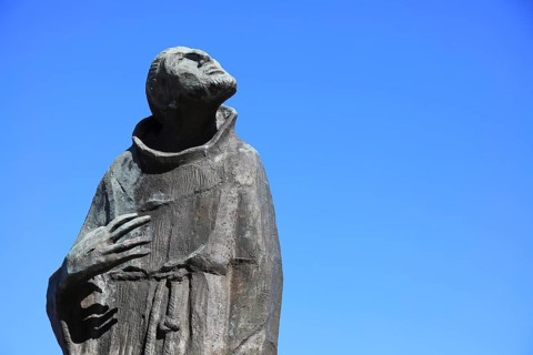 Statue of Francis of Assisi at the pilgrimage church Basilica Vierzehnheiligen near Bad