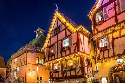 Colourfully illuminated and Christmassy decorated half-timbered houses, old town, blue hour,