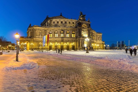 Illuminated Semper Opera House and Theatre Square with snow at dusk, Old Town of Dresden, Saxony,