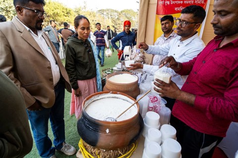 Vendor selling curd and cream dairy product at a stall in Bhogali Mela, ahead of the 'Magh Bihu'