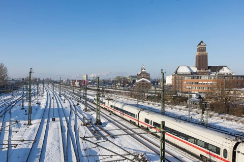 An ICE runs on the railway line next to the BEHALA (Berliner Hafen- und Lagerhausgesellschaft) on