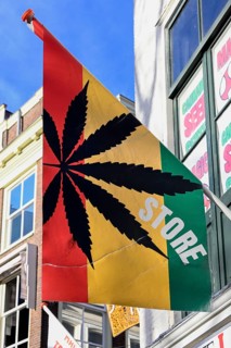 Flag with marijuana leaf at a cannabis shop in the pedestrian zone of The Hague, South Holland
