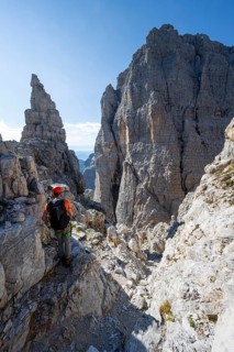 Climbers on the Via Ferrata Bocciere Centrale via ferrata, spectacular mountain landscape with