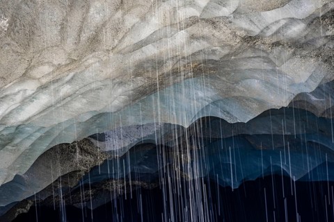 Meltwater at a glacier cave, underground glacier stream, Castner Glacier, Delta Range, Alaska