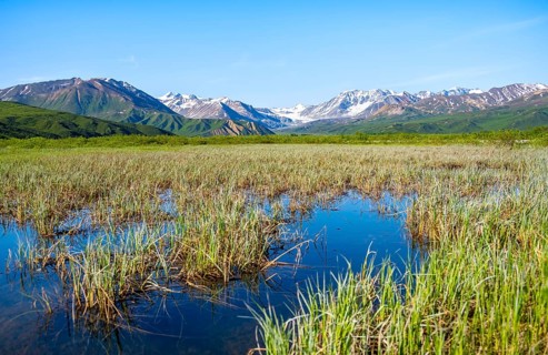 Lake and picturesque mountain landscape with Gulkana glacier and summit Icefall Peak, Richardson
