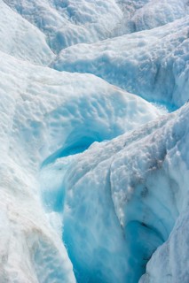 Waterfall in a crevasse on the ice of Root Glacier, Wrangell St. Elias National Park, Alaska, USA