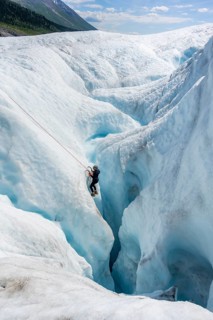 Ice climbers in an ice canyon, Root Glacier, Wrangell St. Elias National Park, Alaska, USA