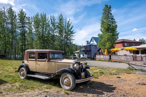 Vintage car and historic building, McCarthy, Wrangell St. Elias National Park, Alaska, USA