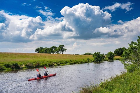 Canoeists do water sports on the Hunte near Astrup, Barneführer Holz, Wardenburg, Lower Saxony,