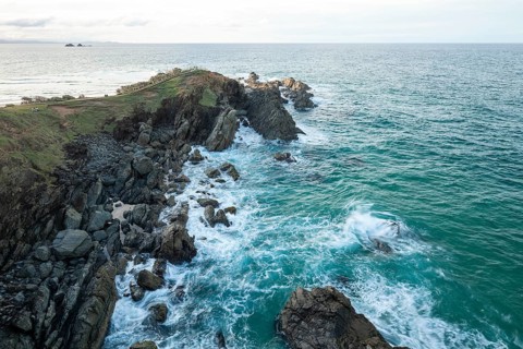 Sunset with wide view over the east coast at Cape Byron, New South Wales, Australia